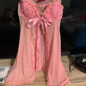 Front closure bralette type with ribbon in front.